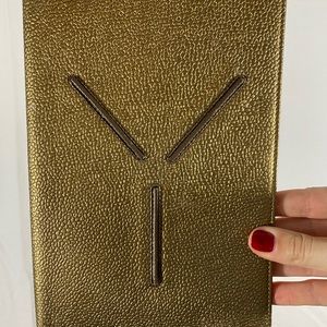 Authentic Gold YSL travel booklet